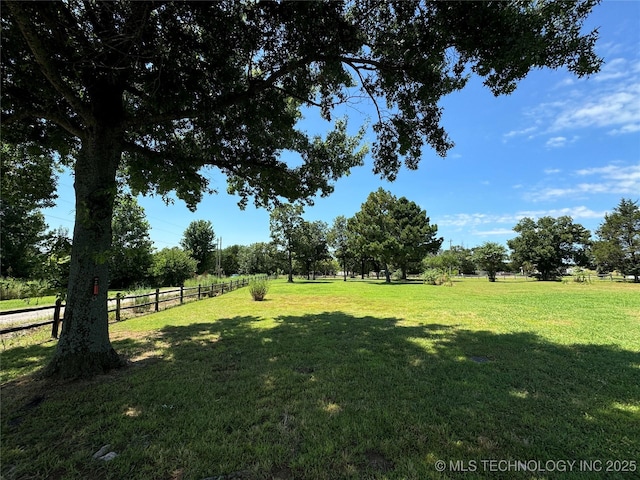 view of yard with a rural view