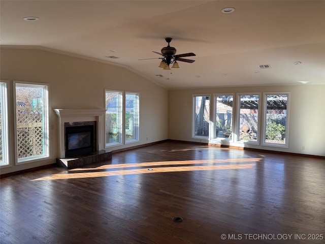 unfurnished living room featuring dark hardwood / wood-style floors, ceiling fan, lofted ceiling, and a premium fireplace