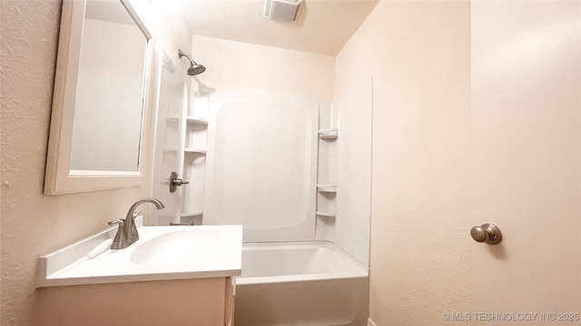 bathroom with vanity and shower / bathtub combination