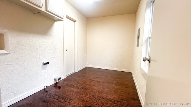 laundry area with dark hardwood / wood-style flooring