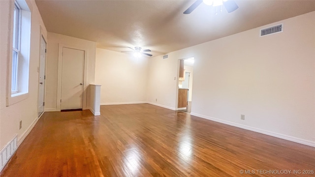 unfurnished room featuring hardwood / wood-style flooring and ceiling fan