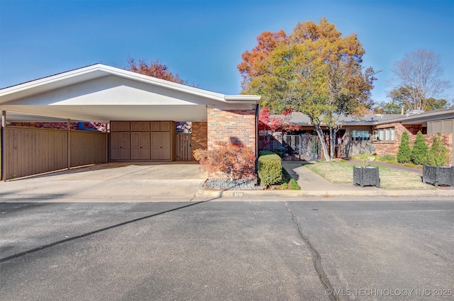 ranch-style house with a carport