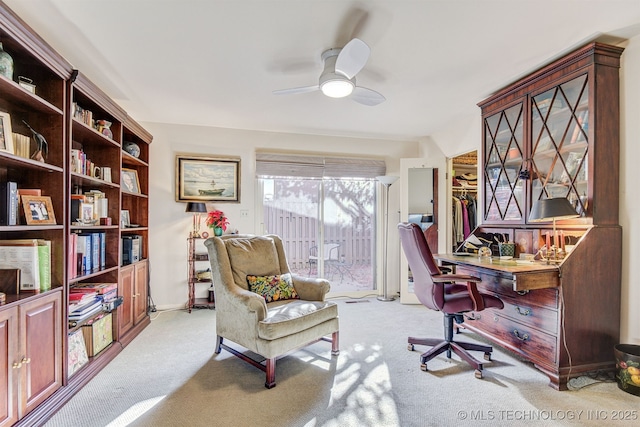 office area featuring ceiling fan and light colored carpet