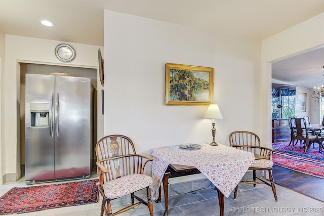 dining area with a notable chandelier