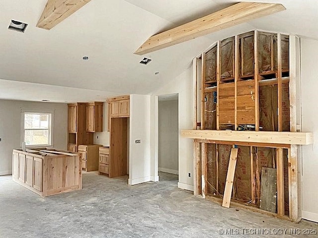 kitchen featuring lofted ceiling with beams