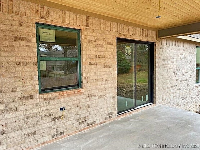 property entrance featuring a patio