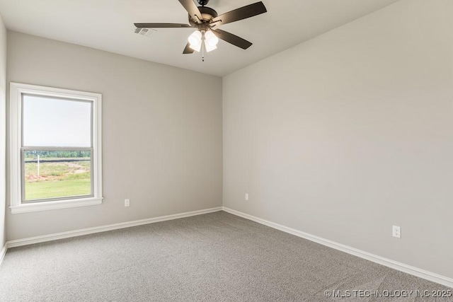 carpeted empty room featuring ceiling fan