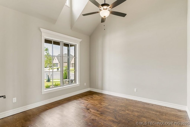 empty room with ceiling fan, dark hardwood / wood-style flooring, and vaulted ceiling