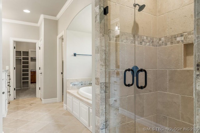 bathroom with tile patterned floors, crown molding, and shower with separate bathtub