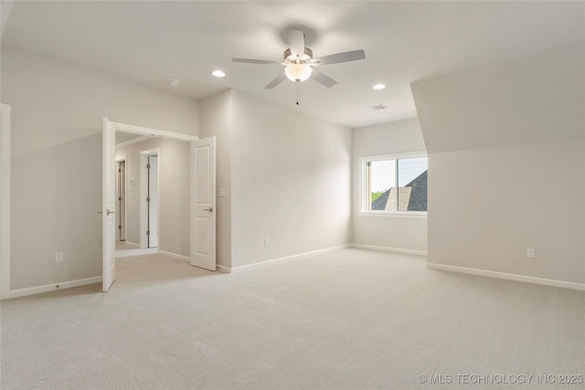 unfurnished room with light carpet and ceiling fan