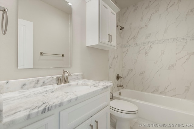 full bathroom with vanity, toilet, and tiled shower / bath