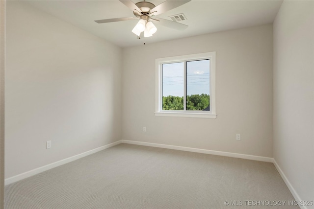 carpeted empty room with ceiling fan