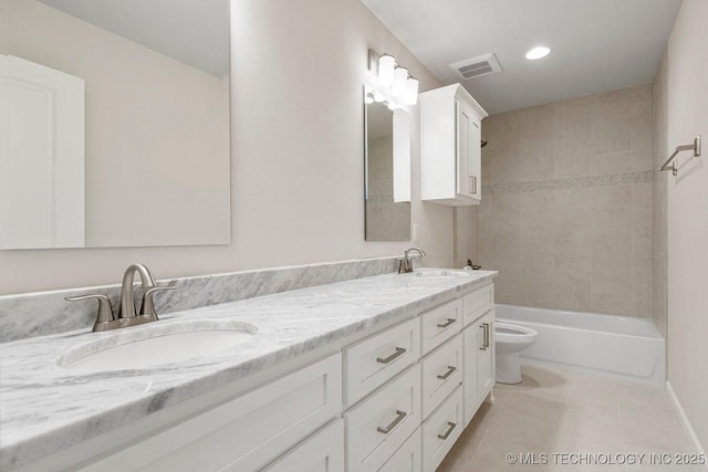 full bathroom with tile patterned flooring, vanity, toilet, and tiled shower / bath combo