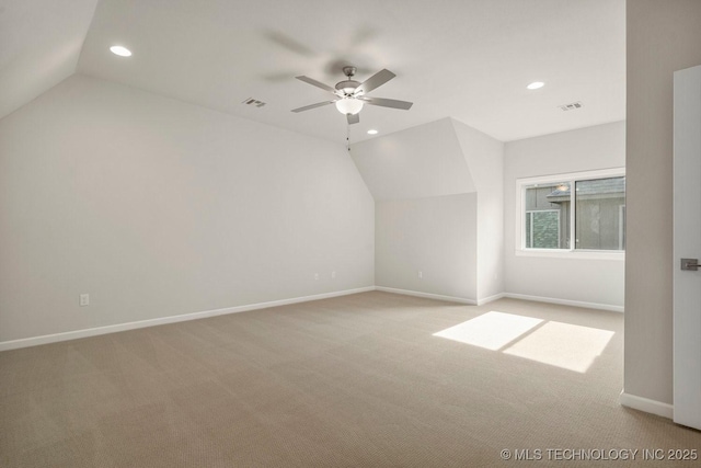 bonus room with ceiling fan, light carpet, and vaulted ceiling