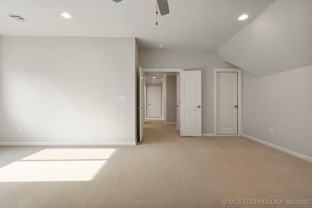 bonus room featuring light colored carpet, vaulted ceiling, and ceiling fan