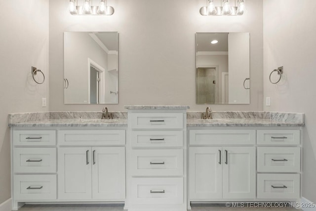 bathroom with vanity and ornamental molding