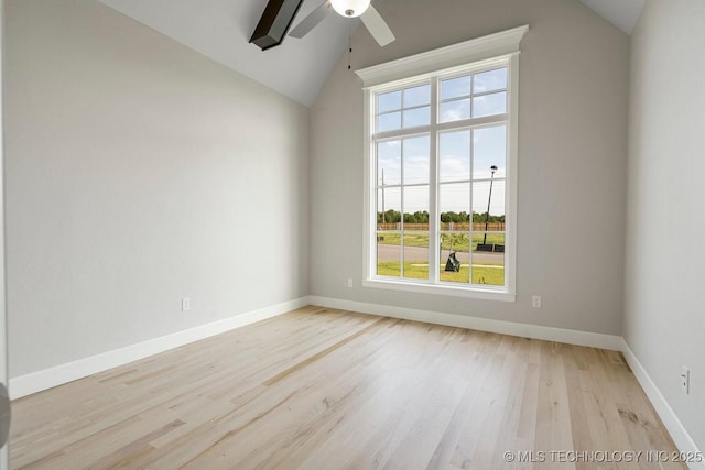 unfurnished room featuring light hardwood / wood-style floors, high vaulted ceiling, plenty of natural light, and ceiling fan