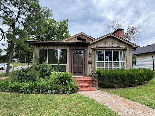 bungalow with a front lawn