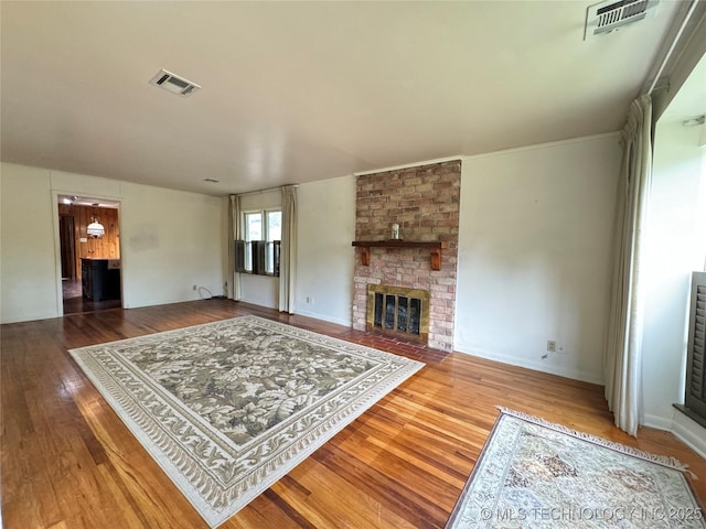 living room featuring a fireplace and hardwood / wood-style flooring