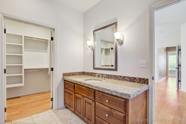 bathroom featuring vanity and wood-type flooring