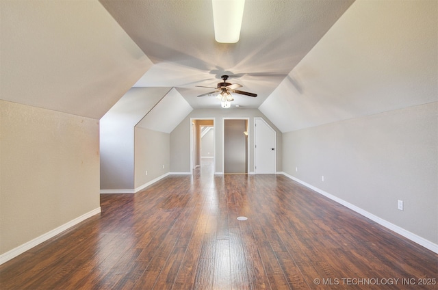 bonus room featuring ceiling fan, dark hardwood / wood-style floors, and vaulted ceiling