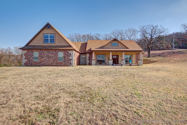 view of front of property with a porch and a front yard