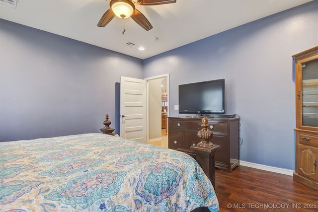 bedroom featuring ceiling fan and dark hardwood / wood-style floors