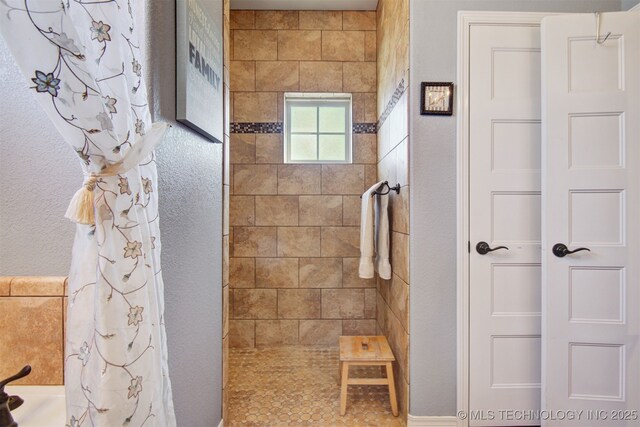 bathroom featuring curtained shower