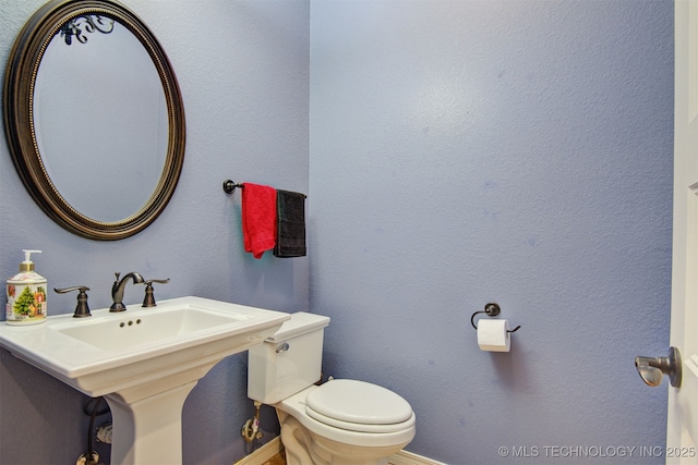 bathroom featuring toilet