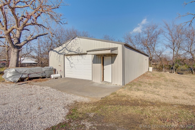 garage featuring a yard