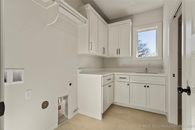 clothes washing area featuring sink, light tile patterned floors, cabinets, and hookup for an electric dryer