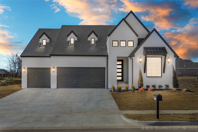 view of front of home with a garage