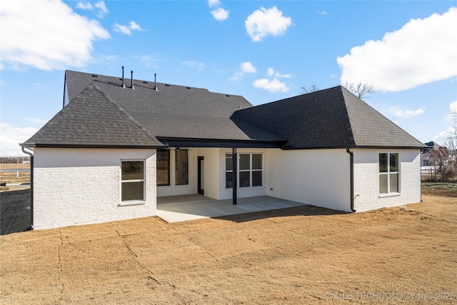 rear view of house featuring a patio