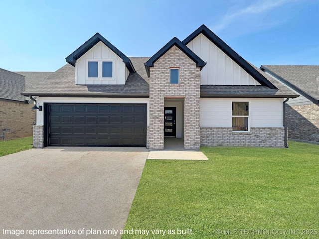 view of front of house with a front yard and a garage