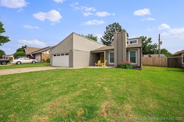 view of front facade with a front yard and a garage