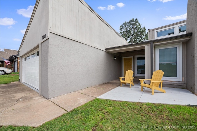 exterior space with a yard and a garage