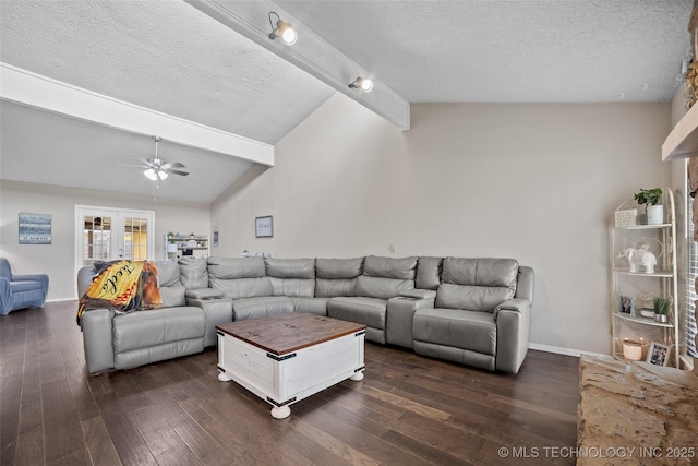 living room with vaulted ceiling with beams, a textured ceiling, french doors, and dark wood-type flooring