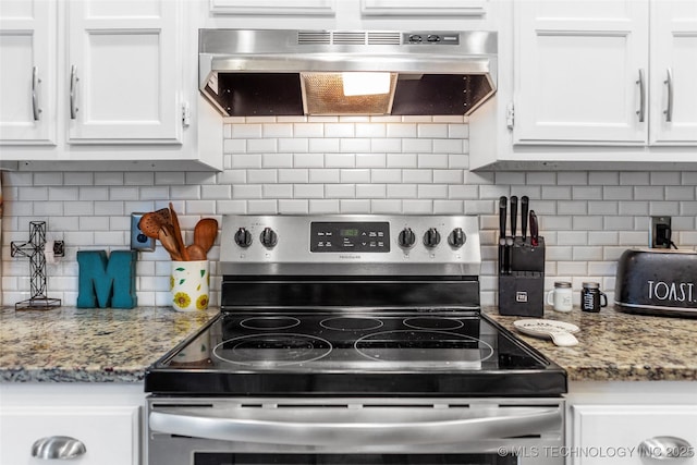 kitchen with white cabinets, decorative backsplash, electric stove, and range hood