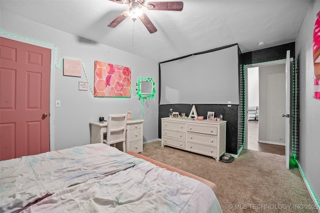 carpeted bedroom with ceiling fan