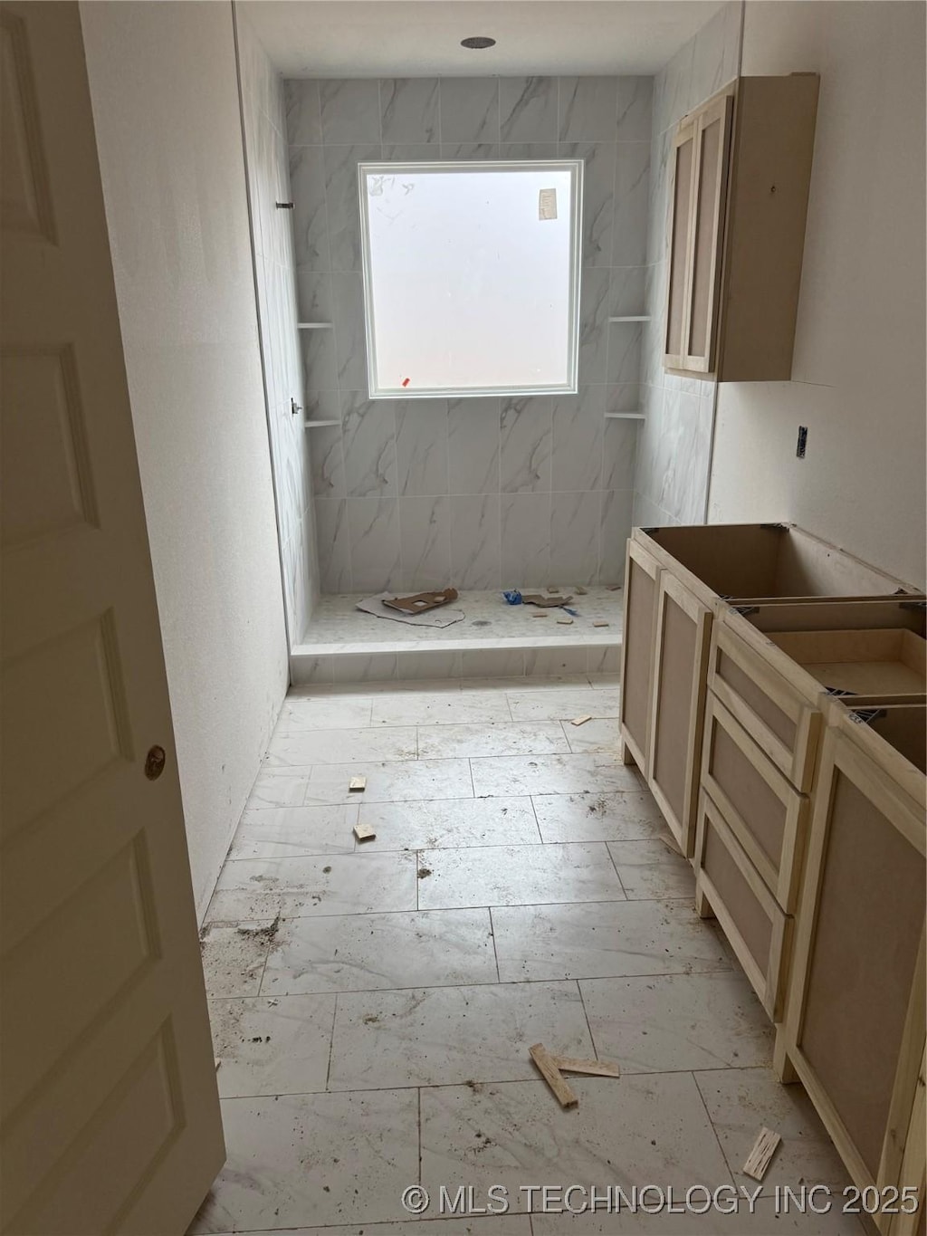 bathroom with tiled shower