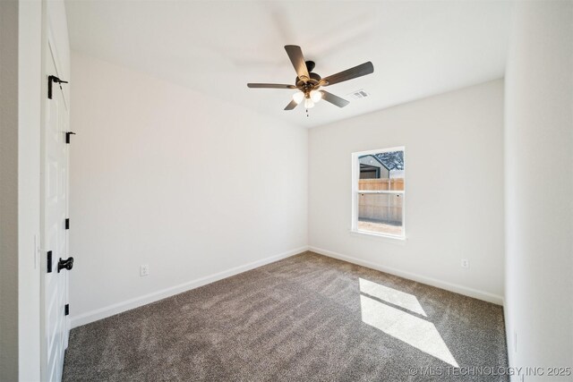 404 W 7th St, Dewey, OK 74029 - spare room with visible vents, baseboards, carpet, and a ceiling fan