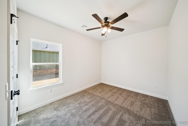 404 W 7th St, Dewey, OK 74029 - carpeted spare room featuring baseboards and ceiling fan