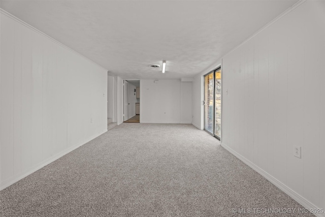 empty room featuring light carpet and ornamental molding