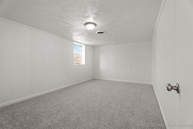 spare room with carpet floors and ornamental molding