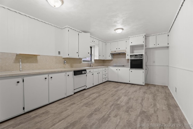 kitchen featuring dishwasher, black oven, stovetop, light hardwood / wood-style floors, and white cabinetry