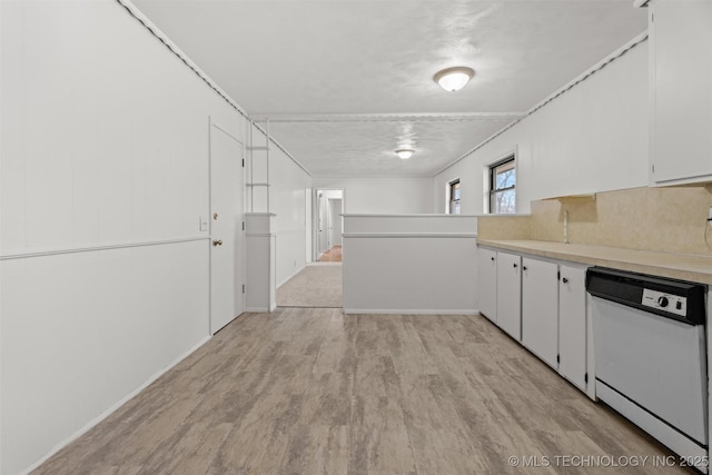 kitchen with dishwasher, white cabinets, and light wood-type flooring