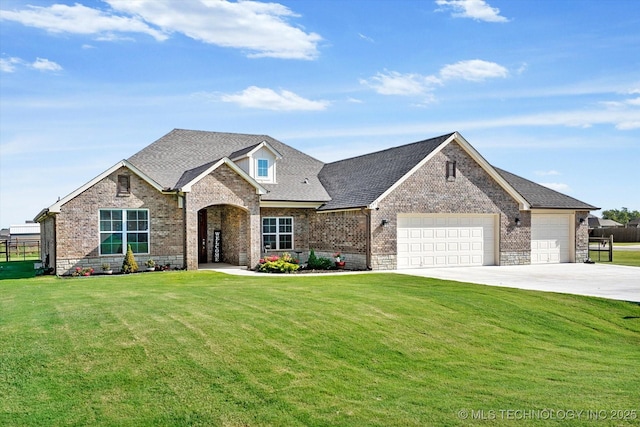 view of front of house with a garage and a front yard