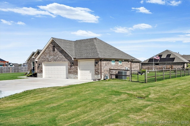 view of home's exterior with a lawn, central AC unit, and a garage