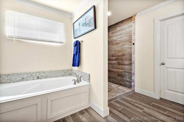 bathroom featuring ornamental molding and independent shower and bath