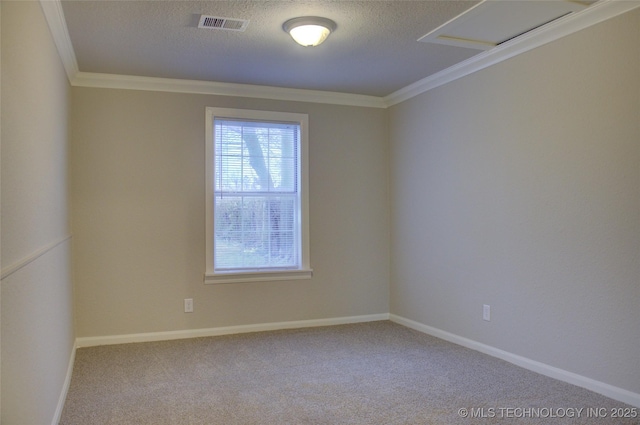 carpeted spare room with a textured ceiling and ornamental molding